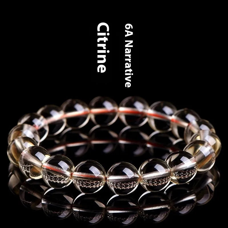 Natural citrine scattered beads ball bracelet showing polished beads on a bracelet base.