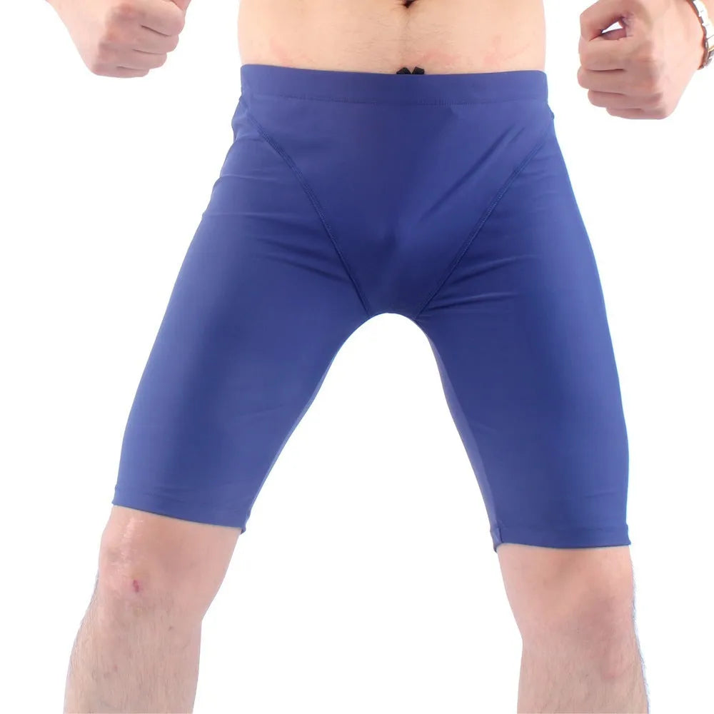 Men's green quick-drying swimming trunks with loose five-point design for swimming