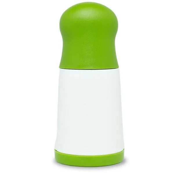 White and grey manual herb grinder with stainless steel blades and removable top on a kitchen counter.