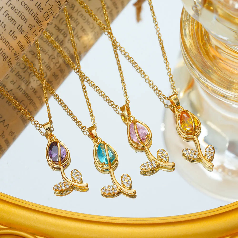 Zircon tulip flower pendant necklace for women on an O-ring chain, shown in a gold colour finish.