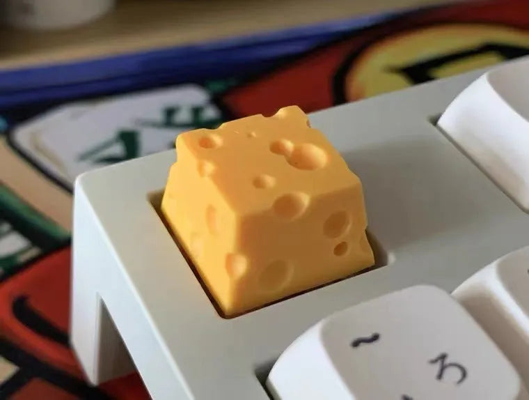 Yellow resin cheese design keycap for mechanical keyboards with Cherry MX switches.