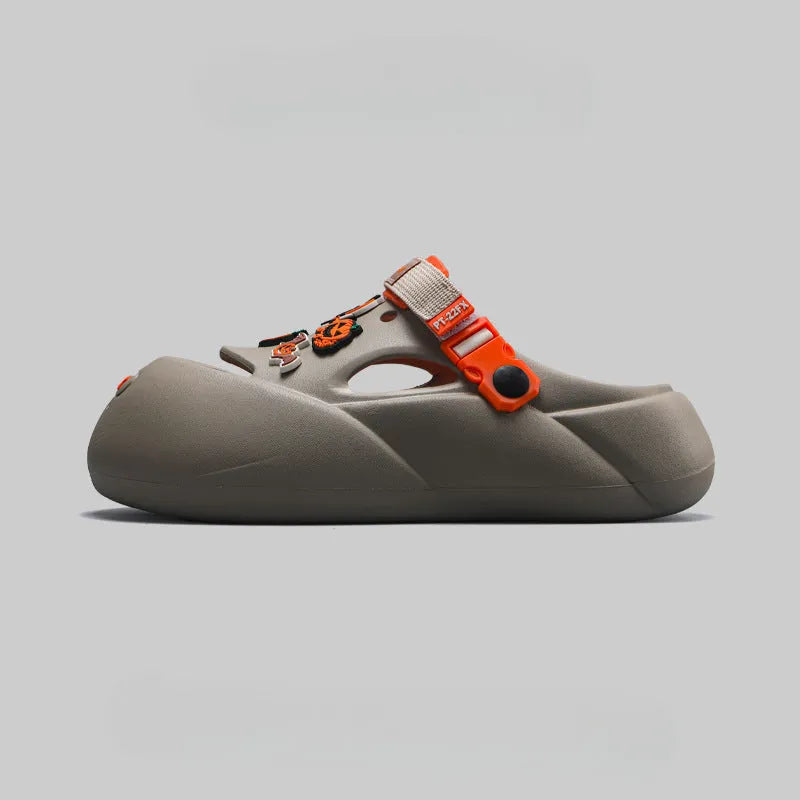Men's grey EVA sole beach hole shoes on a sandy background