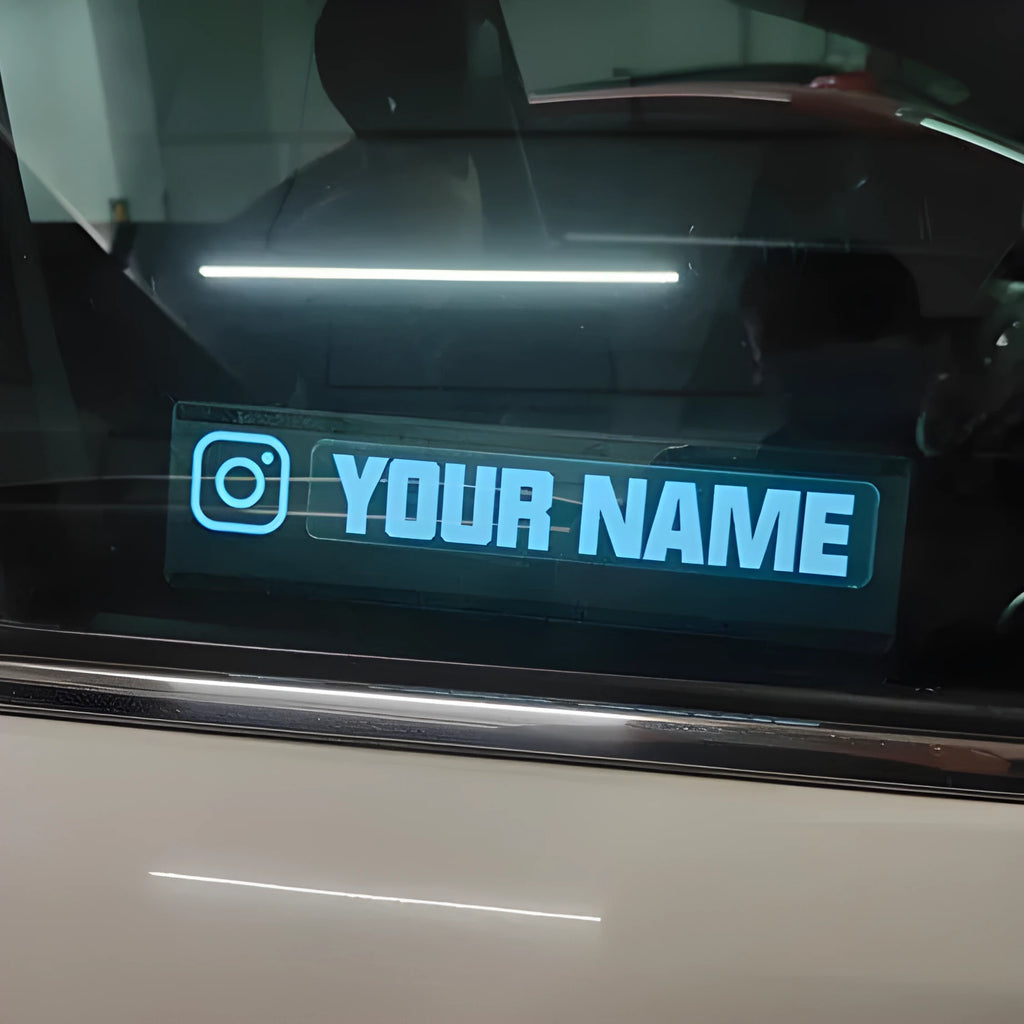 Electroluminescent car window sticker with white glow showing 0.5mm thickness and separate driver components