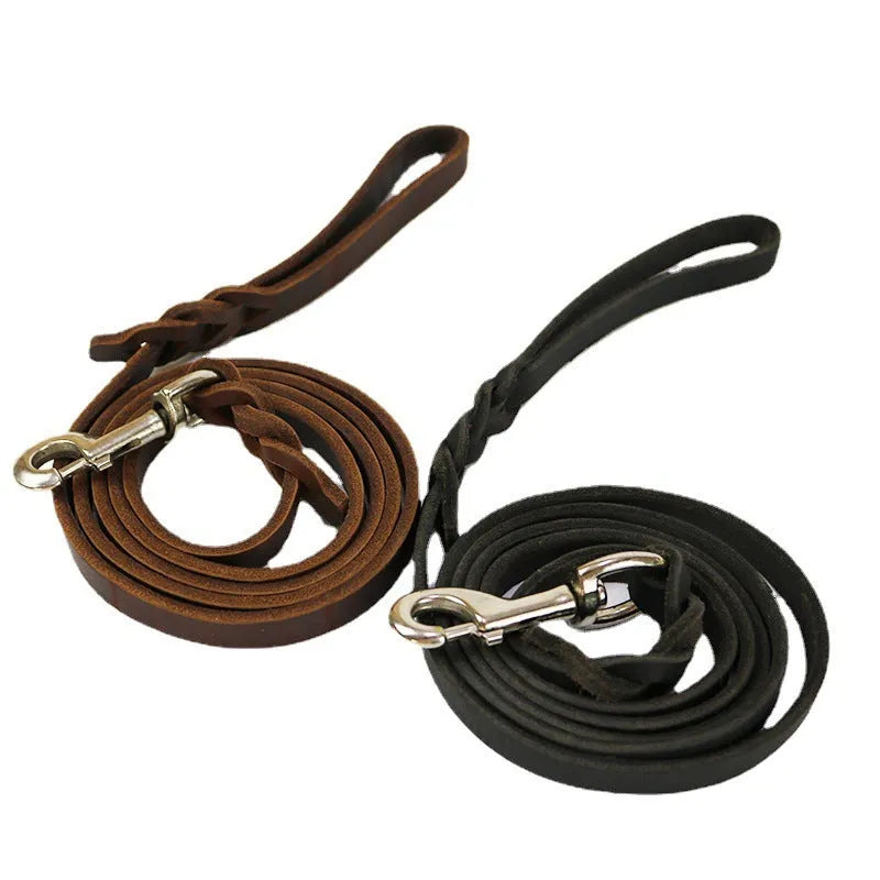 Thickened brown cowhide dog walking rope held in a hand, showing its length and simple strip design.