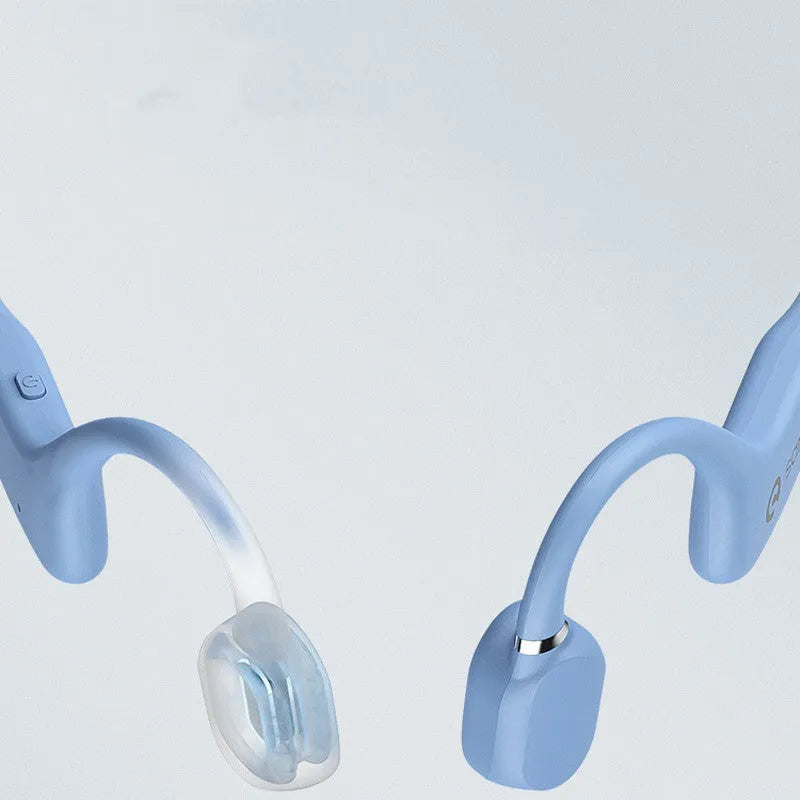 A person wearing bone conduction Bluetooth headphones with a wireless neckband sensor during a run.
