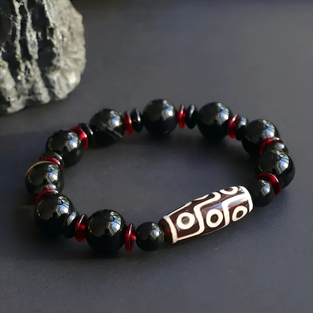 Black agate dzi bead bracelet with 11mm round beads in hand-woven geometry pattern