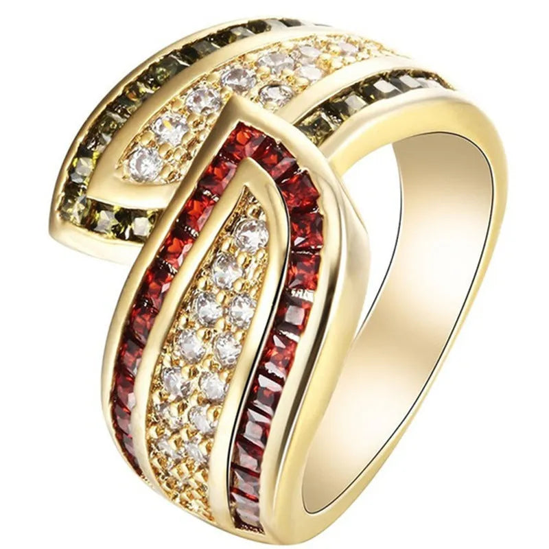 Gold tone alloy women's ring with a central peridot green stone.