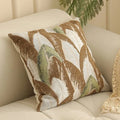 Close-up of a square Jacquard woven cushion cover with a detailed retro floral pattern in various colours.