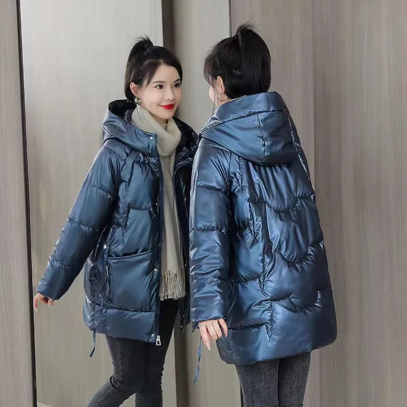 Women's loose-fit hooded winter jacket in blue with thick cotton filling.
