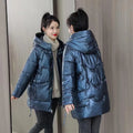 Women's loose-fit hooded winter jacket in blue with thick cotton filling.
