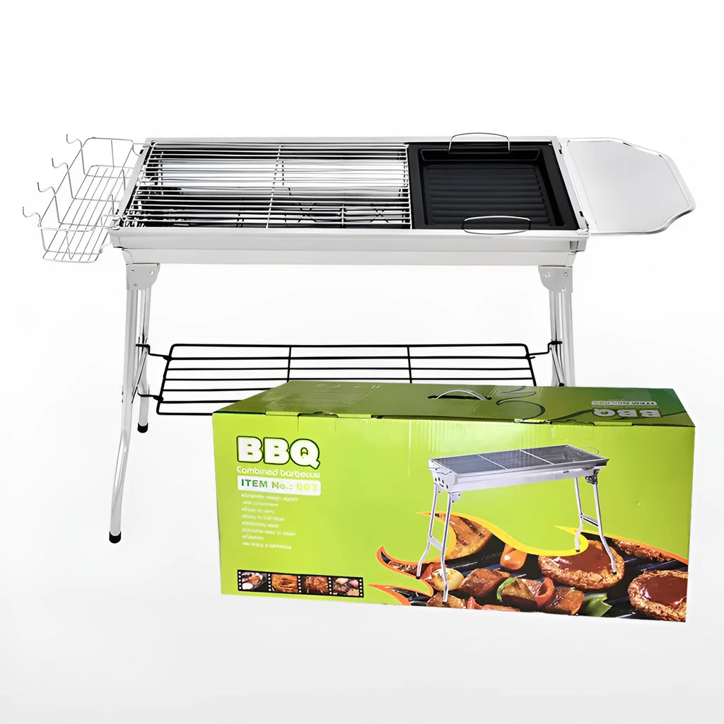 Stainless steel portable folding barbecue oven set up outdoors.