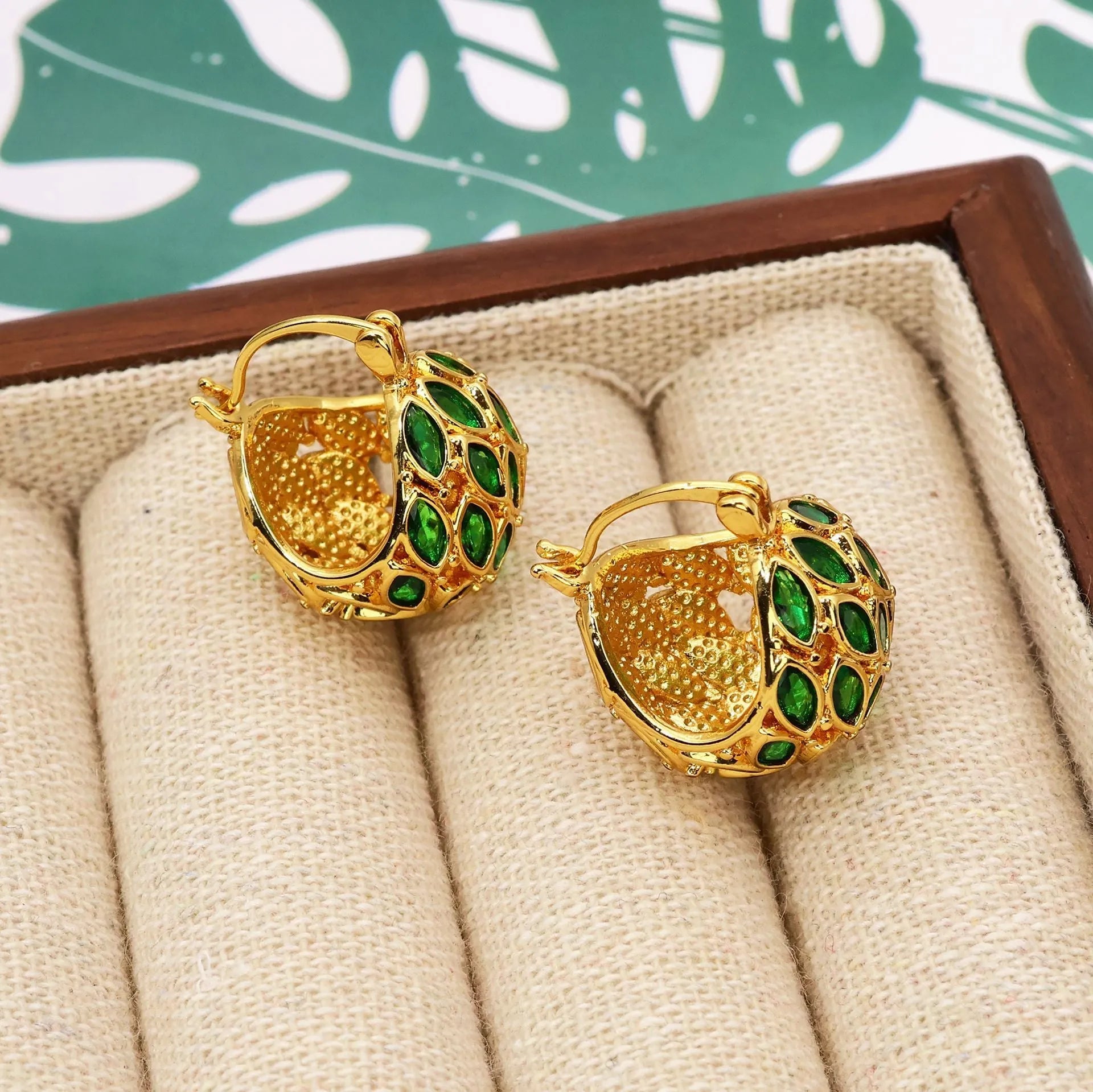 Gold copper earrings with green zircon cabochon in circular fruit shape, vintage style