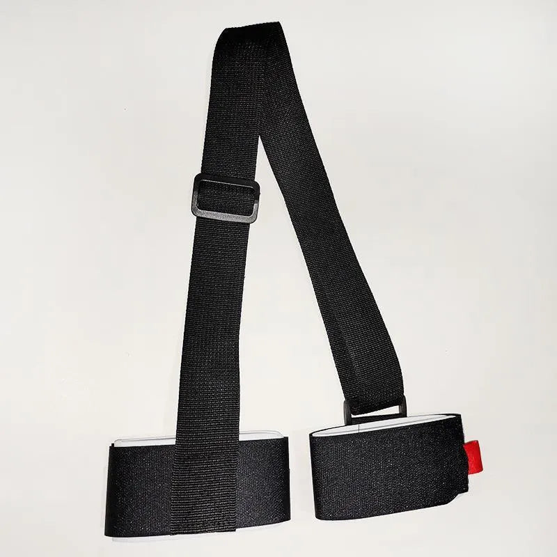 A black adjustable hook and loop strap for securing a skiing bandage to the shoulder during sled sports.
