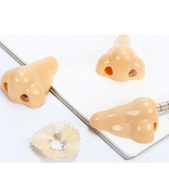 Geometry plastic pencil sharpener with big nostril opening in flesh colour measuring 58x45x30mm