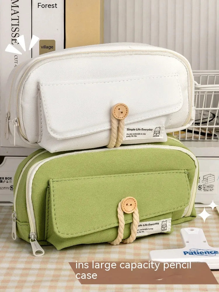 Korean-style large capacity canvas pencil case in green, beige, blue, and grey colour options.