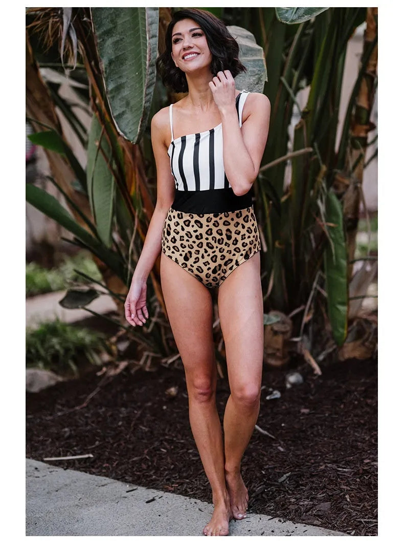 Women's leopard print one-piece swimsuit with asymmetric collar and high-waist brief style.
