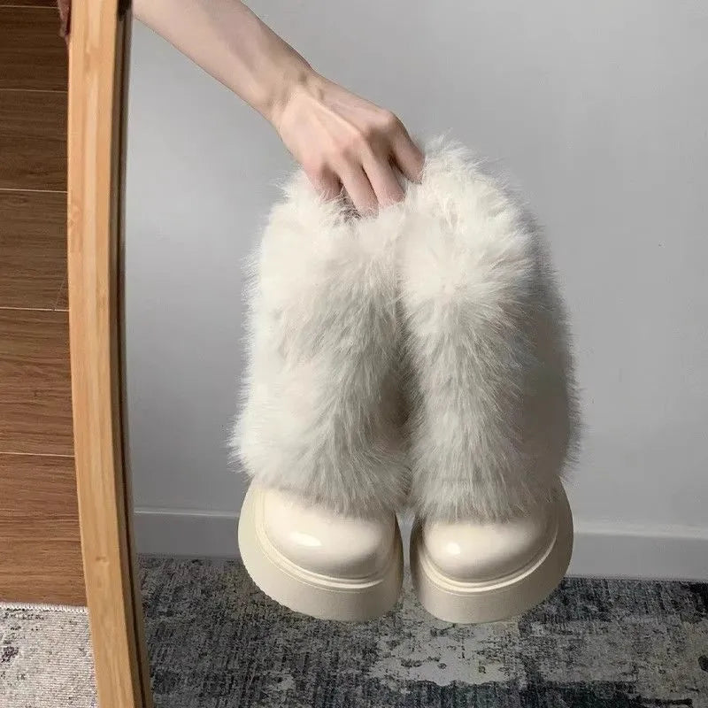Women's black snow boots with fleece lining, waterproof platform, and rubber sole on a white background