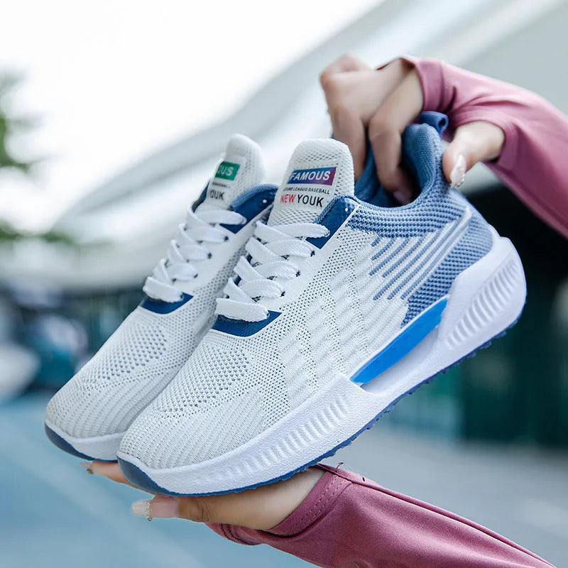 Men's blue casual mesh shoes with round toe and cloth upper on a plain background.