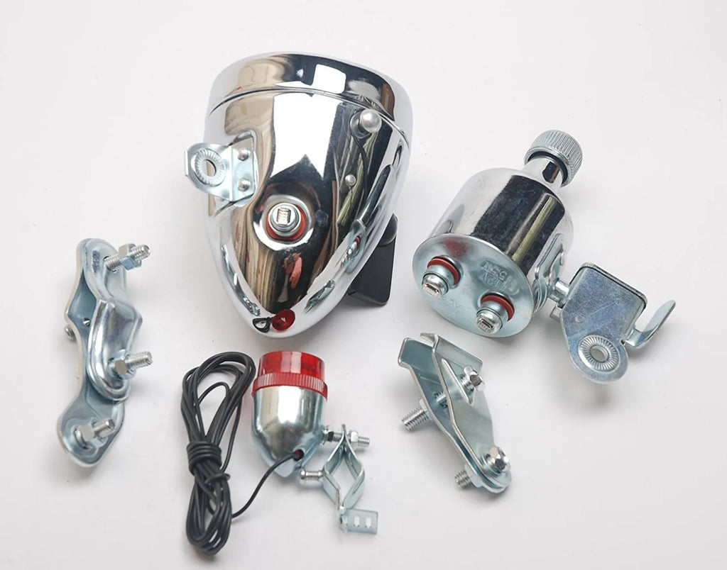 Silver bicycle dynamo-powered generator light kit for front fork or rear frame mounting.