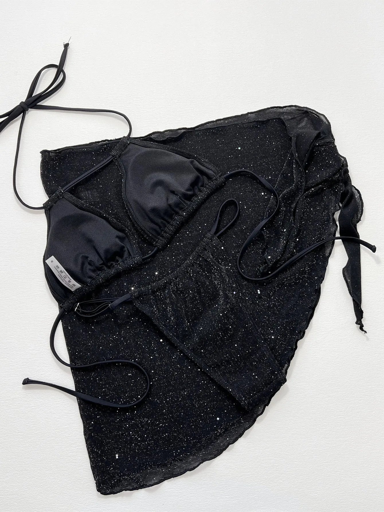 Black polyester fibre bikini set comprising a top and matching shorts on a mannequin.