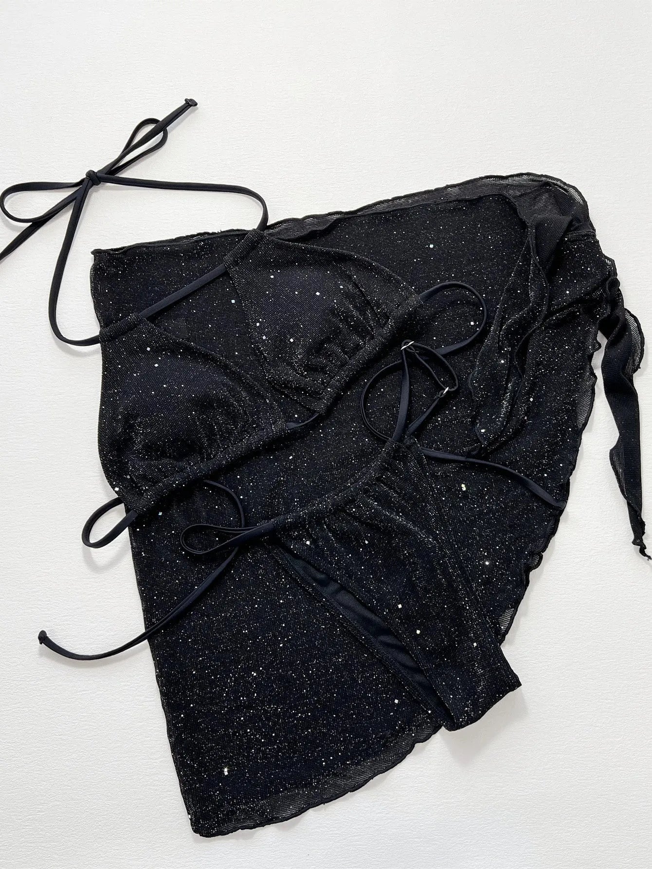 Black polyester fibre bikini set comprising a top and matching shorts on a mannequin.
