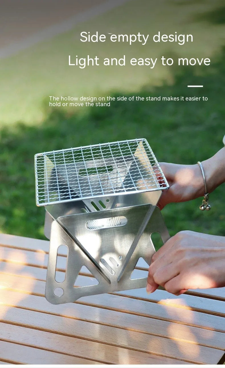 Folding stainless steel outdoor barbecue oven with large grill rack and storage bag.
