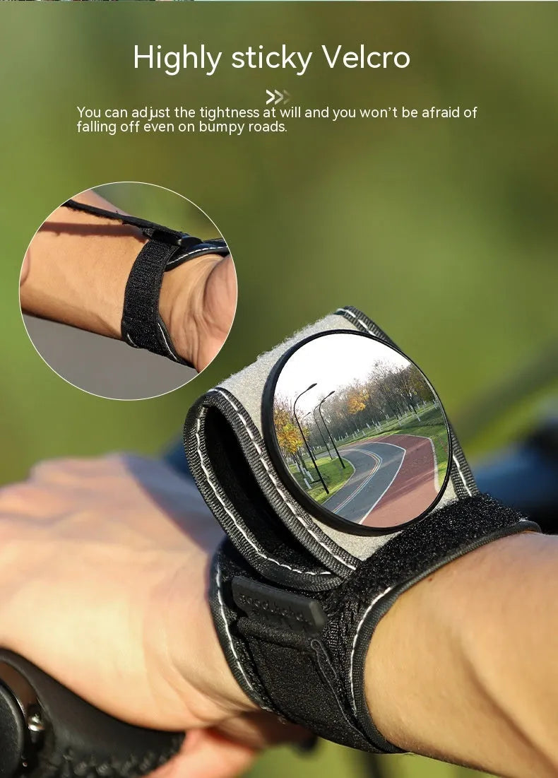 Black nylon bicycle wrist rear-view mirror with adjustable arm extended for cycling visibility