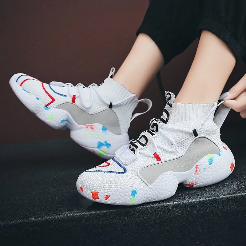 Men's camouflage patterned sneakers with mesh upper and rubber sole on a white background.