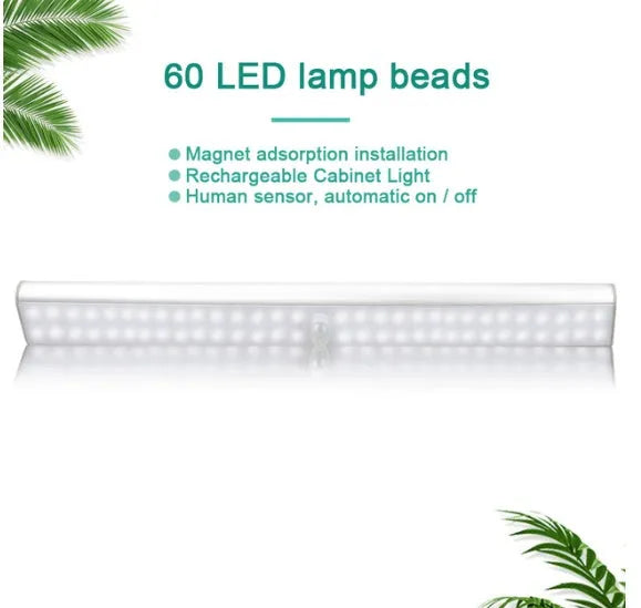 Slim rechargeable LED motion sensor light strip mounted inside a dark cupboard, illuminating the contents.