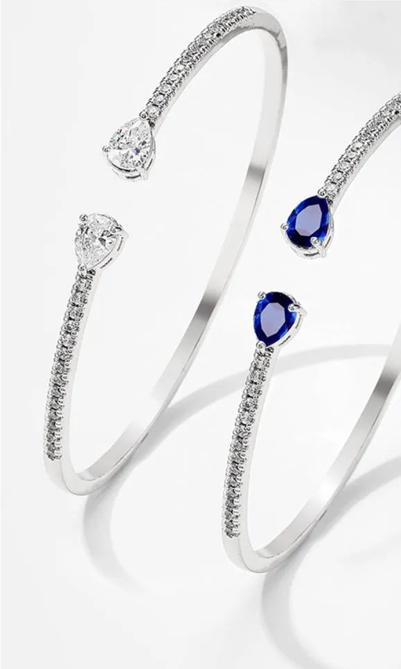 Multi-zircon fashion bracelet crafted from copper with zircon inlaid treatment in white or blue colour
