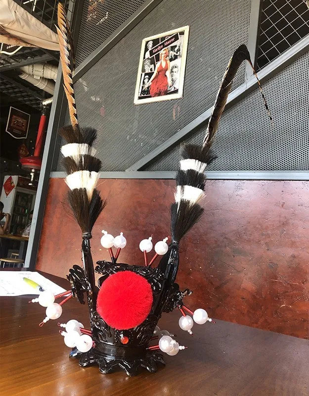 Black crown and long feather motorcycle helmet decoration for personalisation.