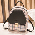 A one shoulder diagonal phone bag made from black PU fabric, shown being worn crossbody.