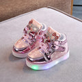 LED magic button sneakers in golden, pink, and silvery metallic finishes with illuminated soles