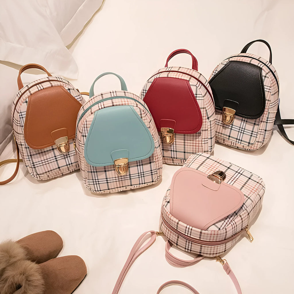 A one shoulder diagonal phone bag made from black PU fabric, shown being worn crossbody.