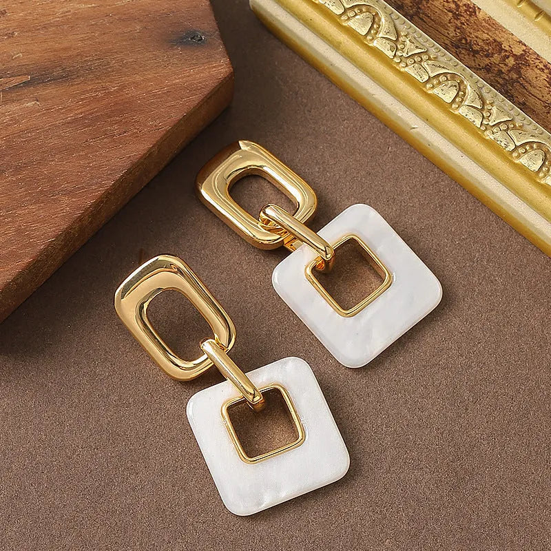 Copper hollow geometric square earrings with chamfered corners in gold or blue electroplated finish