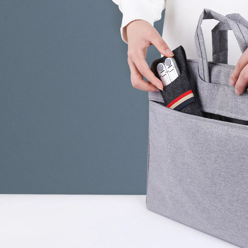 Foldable aluminium laptop stand in silver, shown open for use and folded for storage.