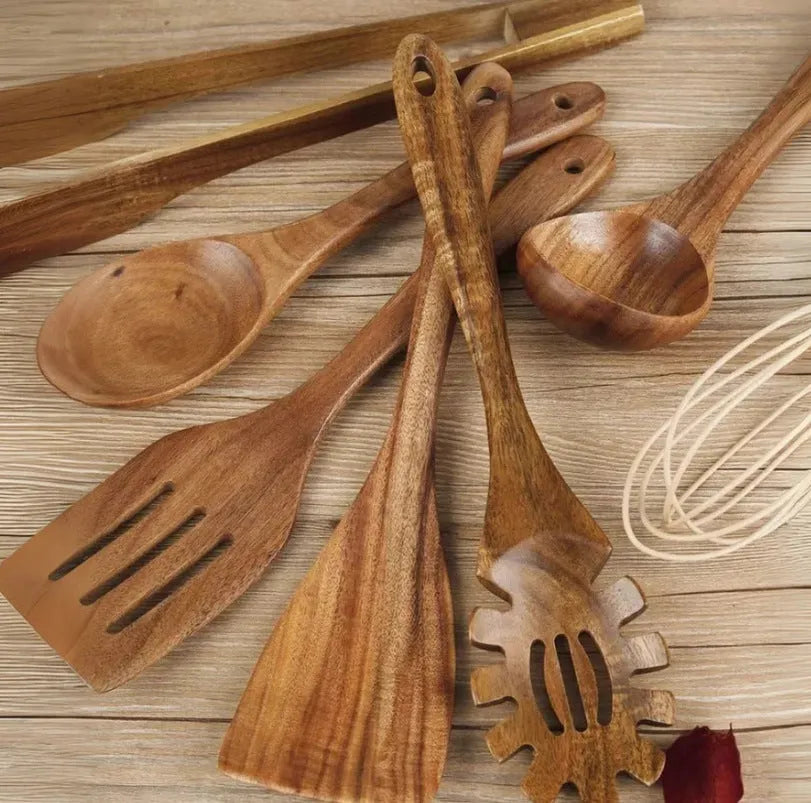 Seven wooden spoon shovels arranged together as a cooking utensil set for non-stick pans