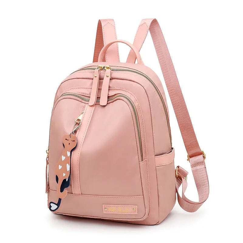 Black and pink women's casual nylon backpack showing soft surface and shoulder straps