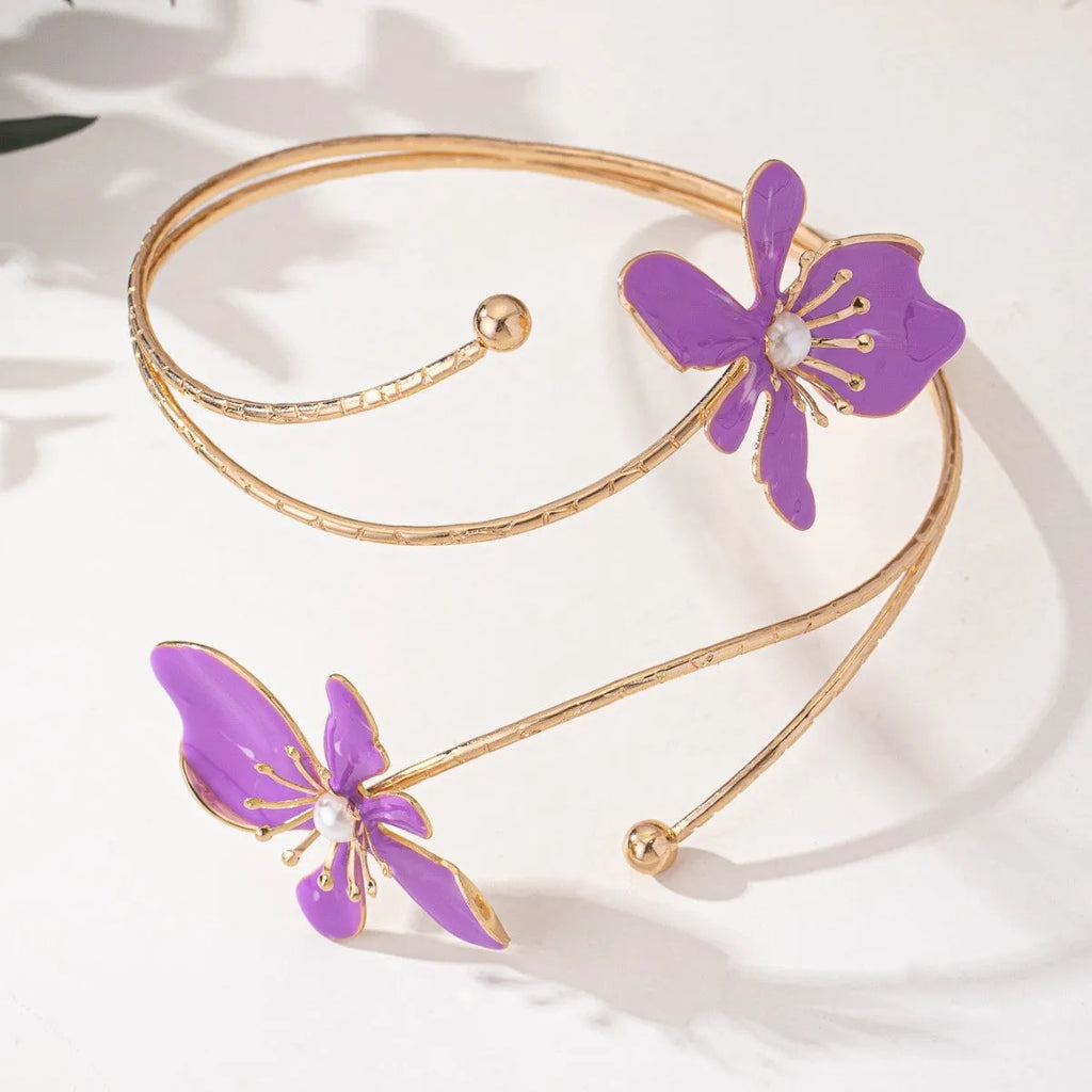 Pink personalised hollow pattern alloy armband open ring bangle on a wrist.