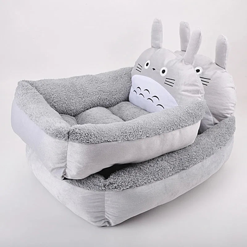 A cartoon-style soft plush sofa bed for a small dog or cat, shown in a grey colour.