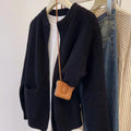 Beige viscose soft wind sweater coat, a long sleeve cardigan laid flat.