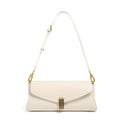 Cowhide leather women's cross-body bag in a clamshell, pillow-shaped design.