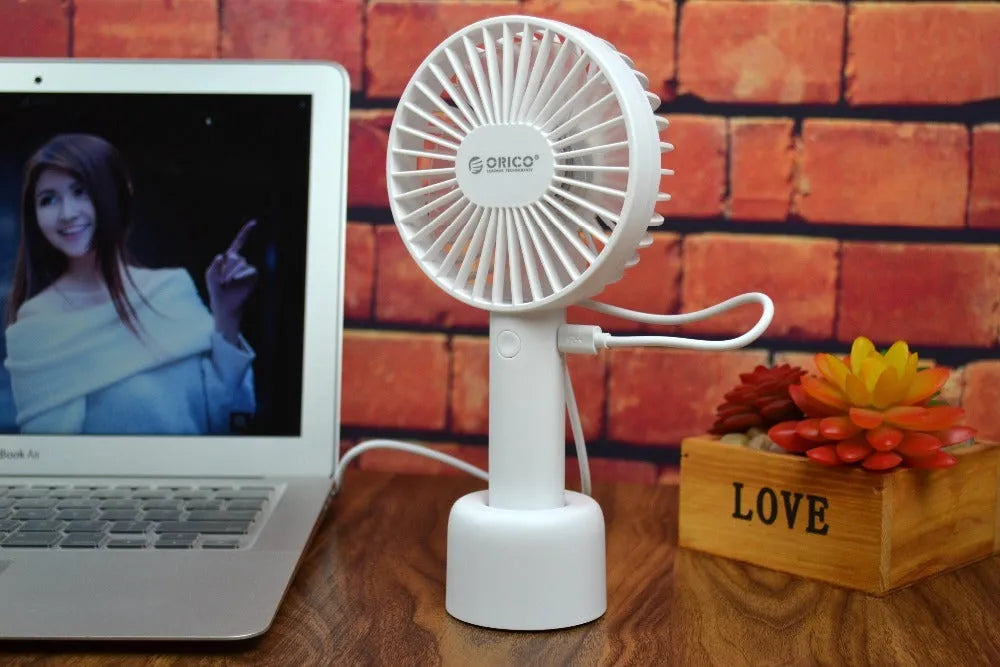 White ORICO FH1 rechargeable USB desktop and handheld fan showing fine line details on its ABS shell.