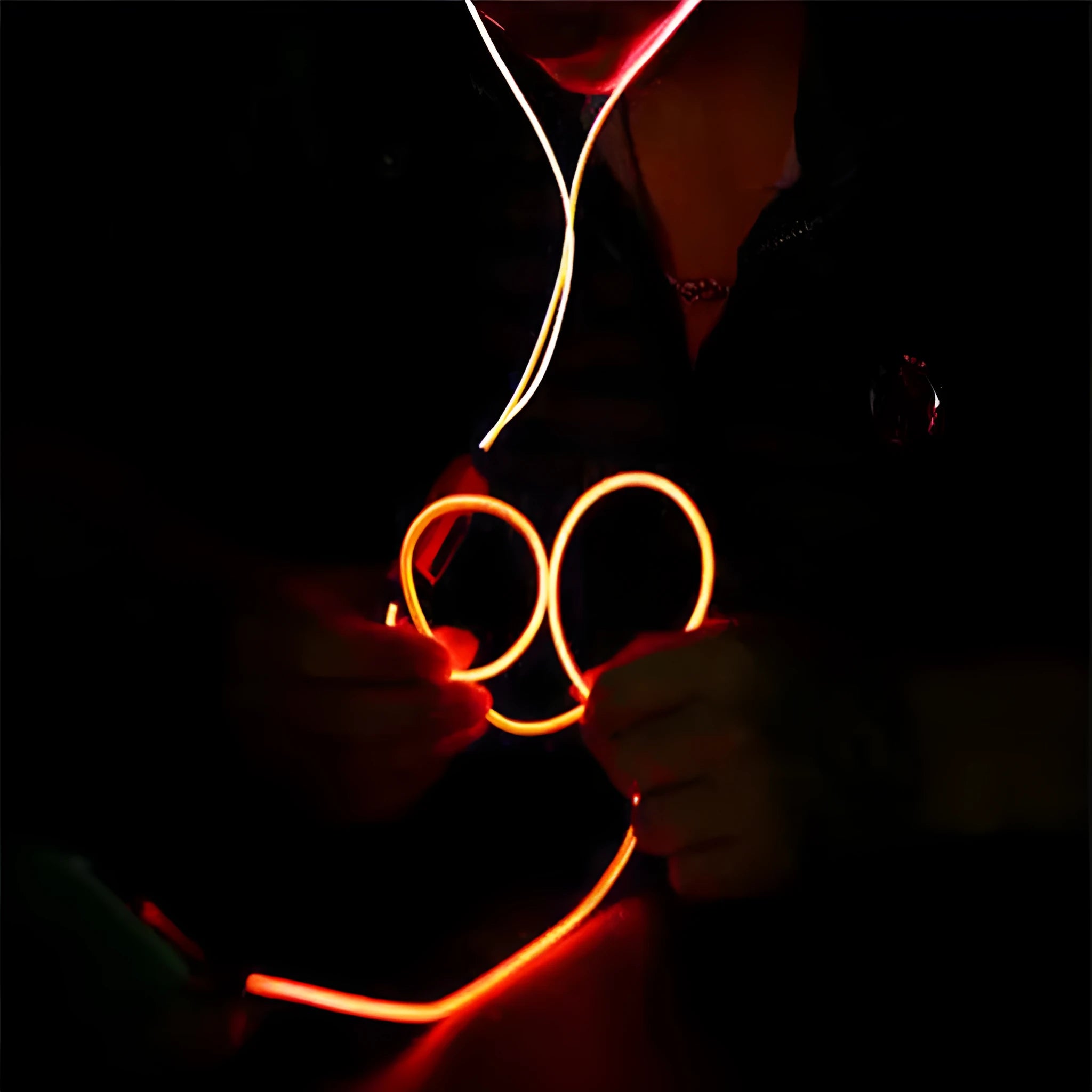 Blue LED light-up earphones with 3.5mm jack and inline remote control, showing illuminated ear shells.