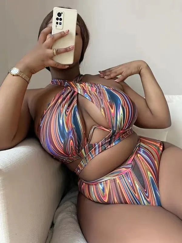 Women's floral high-waist bikini swimsuit top and pants in plus sizes.
