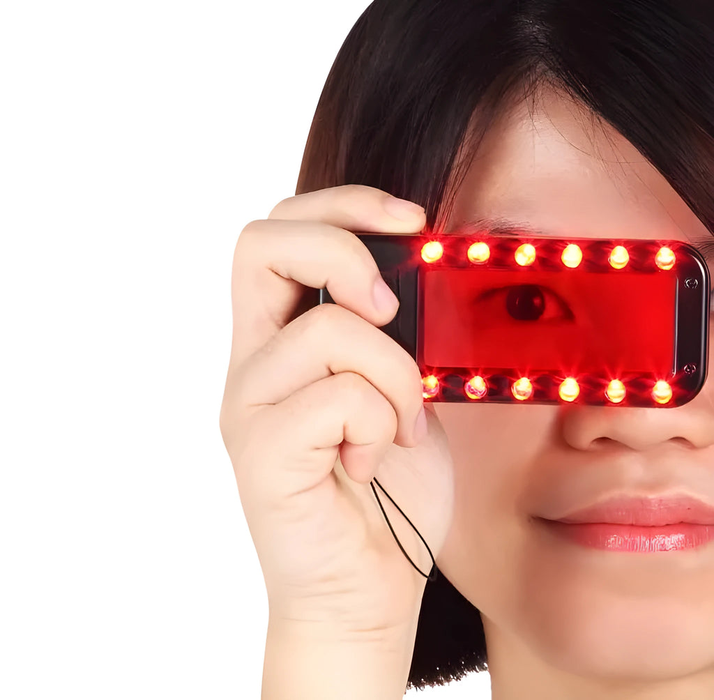 Small red reverse camera detector unit with a scanner window for detecting hidden surveillance lenses.
