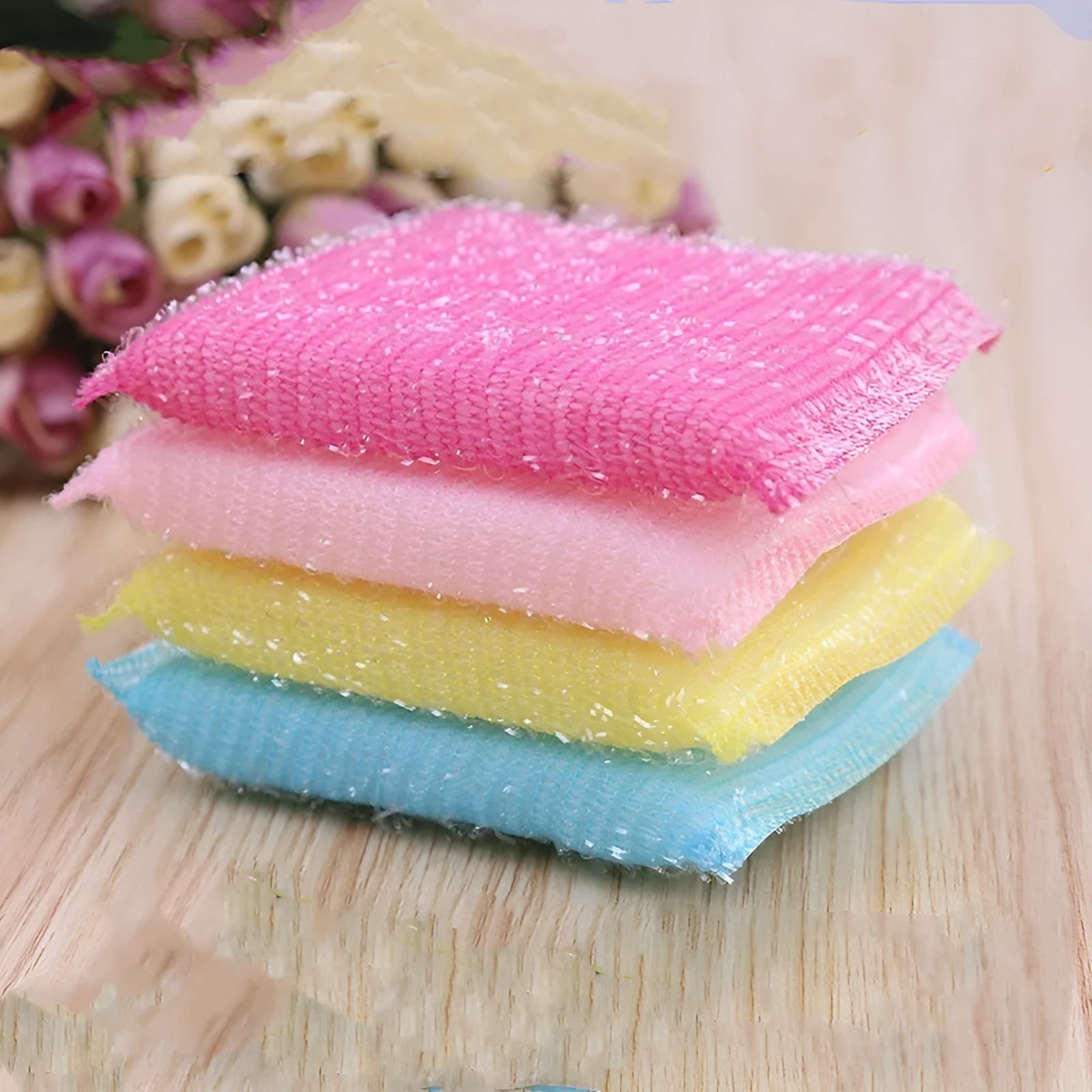 Pinstripe fabric dishwashing sponge mop in macaron colours shown on a kitchen counter.