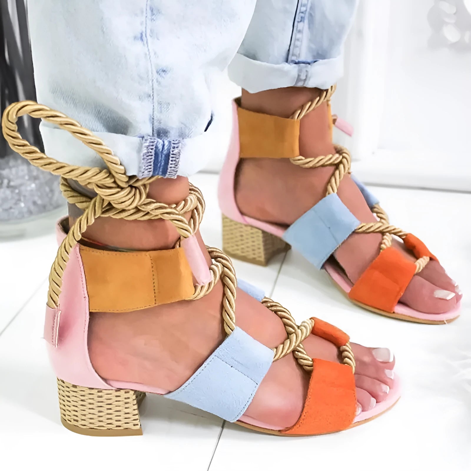 Women's beige suede sandals with thick middle heel, fish mouth toe, and ankle strap.