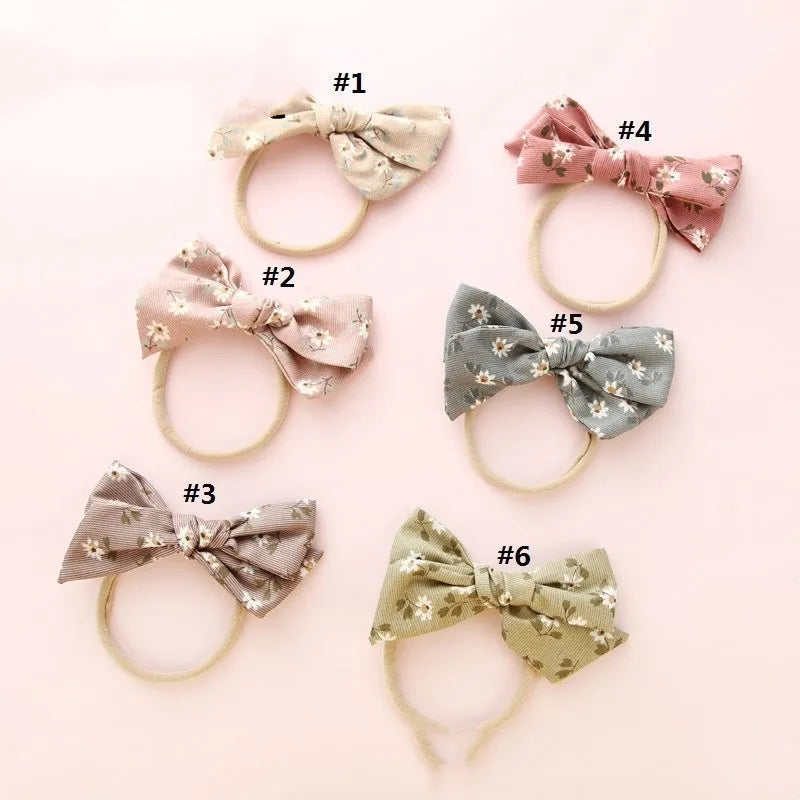 Children's knotted bow hair band in cloth fabric with six colour options