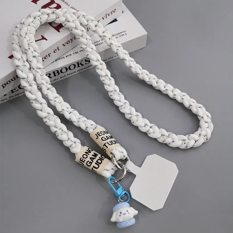 Woven nylon crossbody phone lanyard with macaron pendant in Pink Dot Gray, showing three-strand horse tail detail and matching clip.